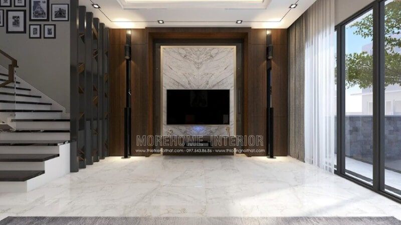 Trang trí phòng khách với đá trắng đối vân ốp tường đen cùng trang trí đối sánh giữa hai dàn loa dọc theo đường chiếu sáng từ mảng tường gỗ đẹp mắt.